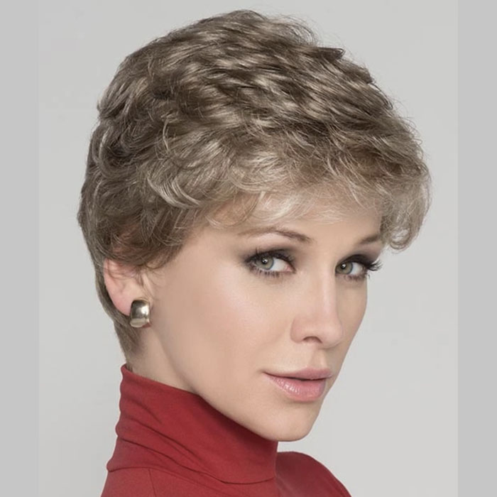 A women modeling light curly blonde wig.